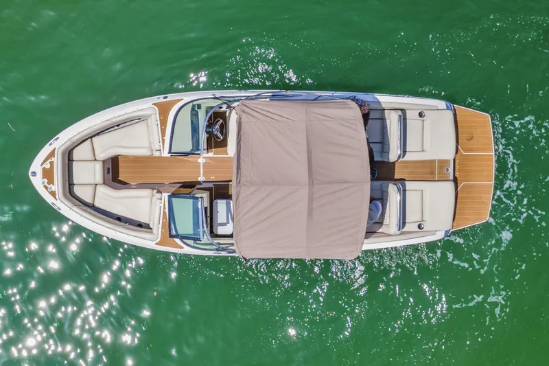 Slide: The Image of Overhead view of 2019 Regal LS4 boat on green water. - 5