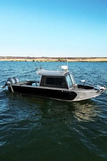 Slide: The Image of Custom Umpqua Marina 26 Bay Series boat on water, 2022 model, with dual engines. - 10