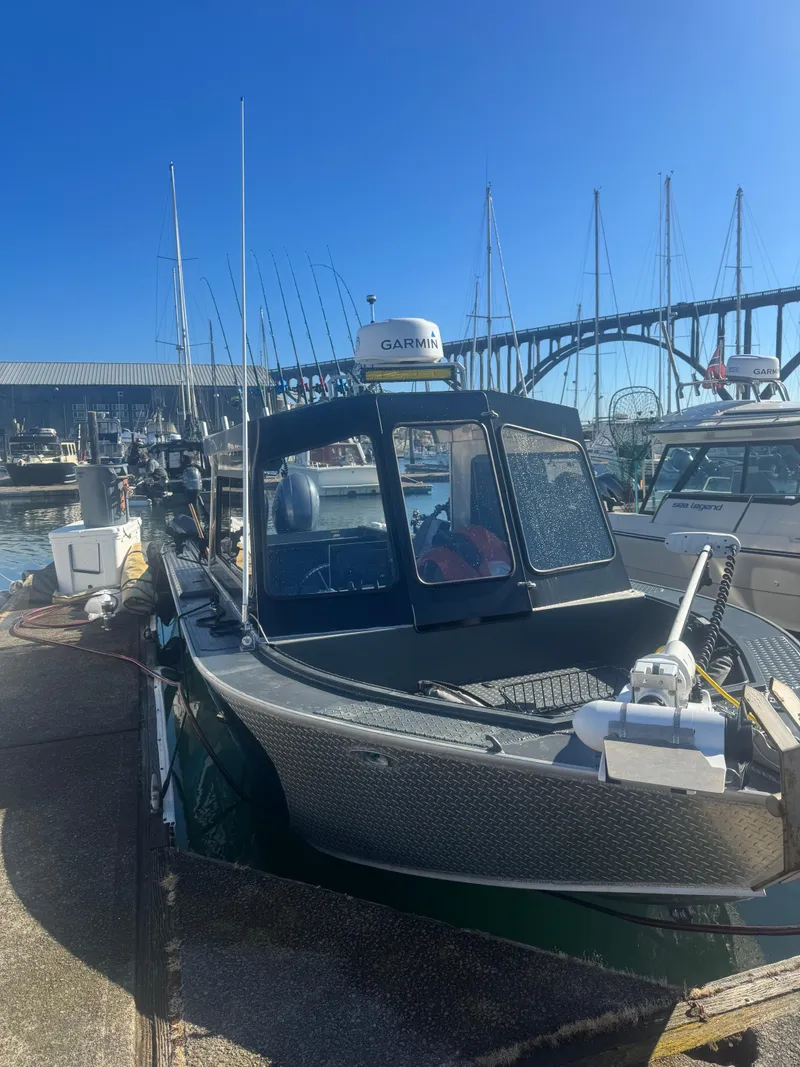 Slide: The Image of Custom Umpqua Marina 26 Bay Series boat docked, 2022 model, with Garmin equipment. - 3