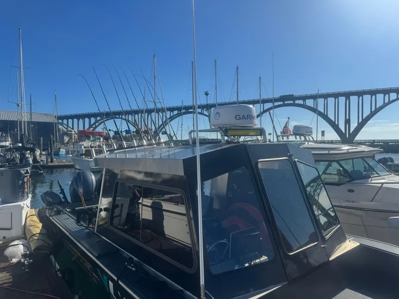 Slide: The Image of Custom Umpqua Marina 26 Bay Series boat docked at marina, 2022 model. - 4