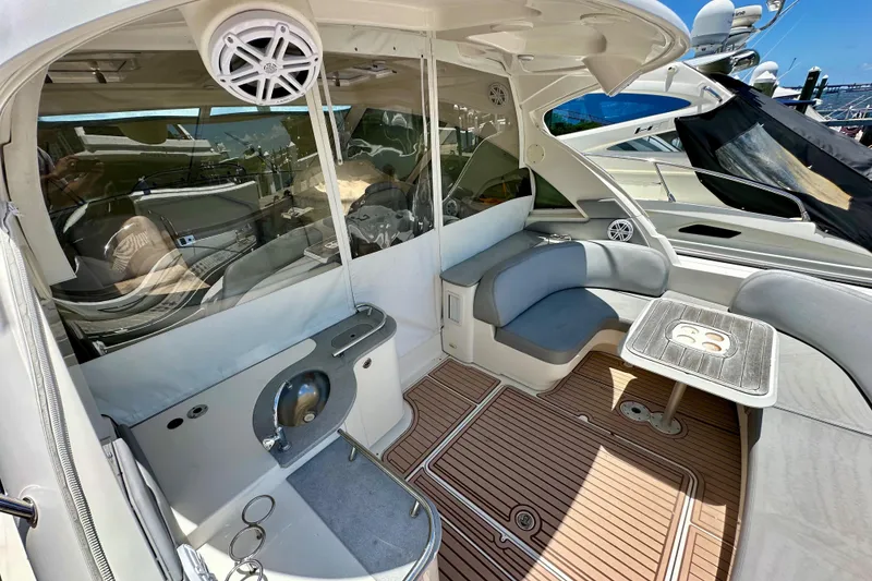 Slide: The Image of 2005 Sea Ray 48 Sundancer yacht interior with seating, table, and speaker system. - 7