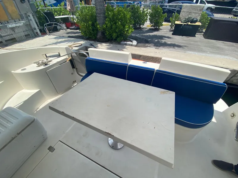 Slide: The Image of Azimut 46 yacht interior with blue seating and white table, 2000 model. - 27