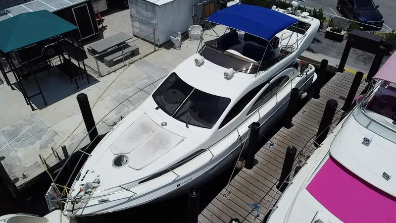 Slide: The Image of Azimut 46 yacht from 2000 docked with blue canopy, aerial view. - 5
