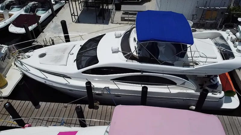 Slide: The Image of Azimut 46 yacht from 2000 docked with blue canopy, aerial view. - 6