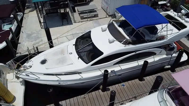 Slide: The Image of Azimut 46 yacht from 2000 docked with blue canopy, aerial view. - 8