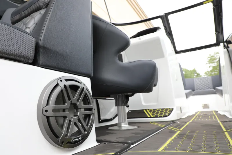 Slide: The Image of 2023 Scarab 255 ID boat interior with speaker and seating detail. - 11