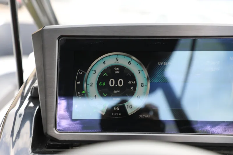 Slide: The Image of Dashboard of 2023 Scarab 255 ID boat showing speedometer and digital display. - 12
