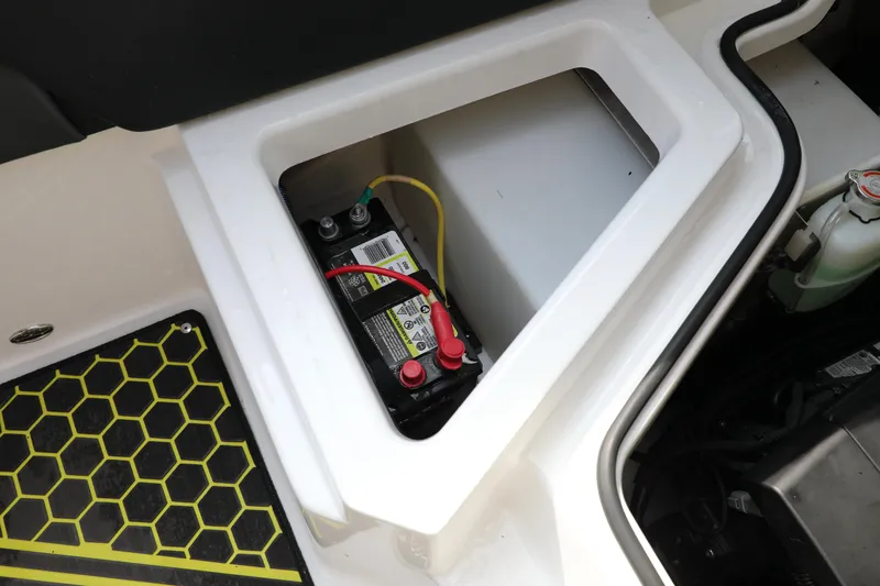 Slide: The Image of Battery compartment of 2023 Scarab 255 ID boat, featuring secure wiring and modern design. - 16
