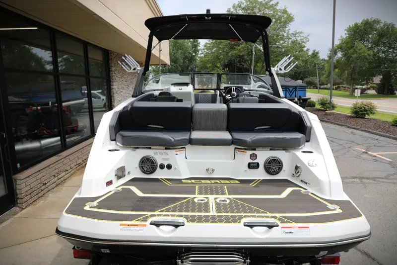 Slide: The Image of 2023 Scarab 255 ID boat, rear view, showcasing seating and deck design. - 17