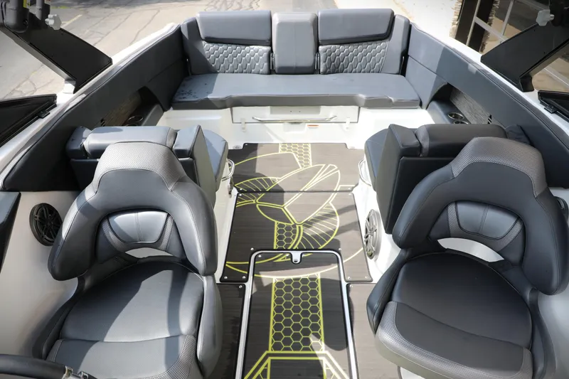Slide: The Image of 2023 Scarab 255 ID boat interior with modern seating and stylish flooring design. - 5