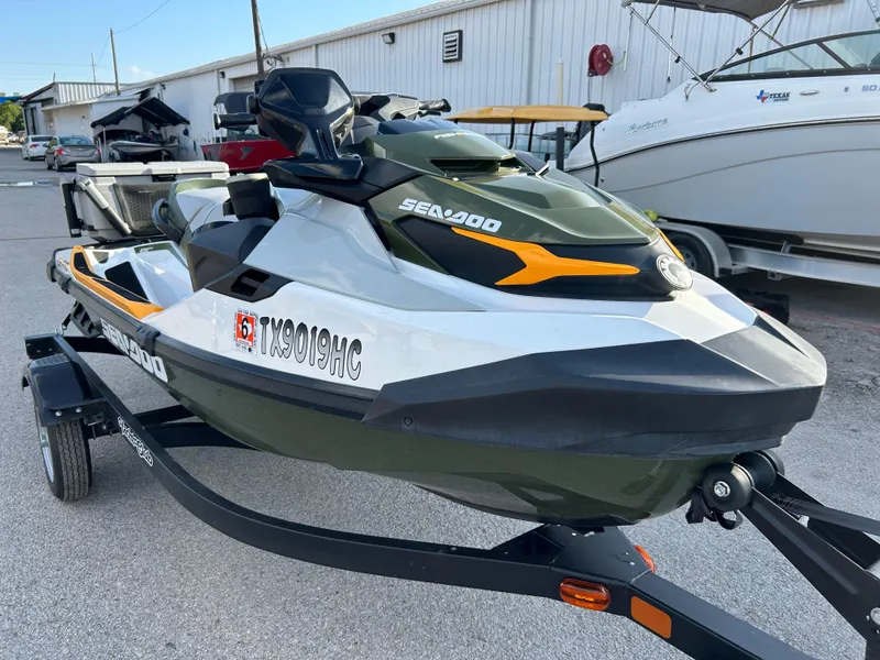 Slide: The Image of 2020 Sea-Doo FISH PRO 170 jet ski on trailer, parked outdoors. - 19