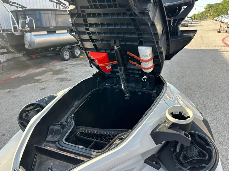 Slide: The Image of 2020 Sea-Doo FISH PRO 170 storage compartment open, showing interior and accessories. - 24
