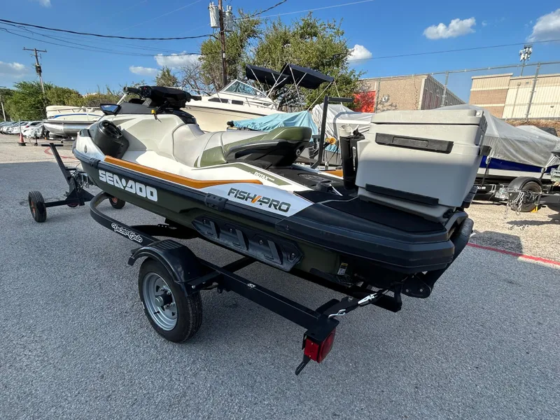 Slide: The Image of 2020 Sea-Doo FISH PRO 170 on trailer, parked outdoors under clear sky. - 28