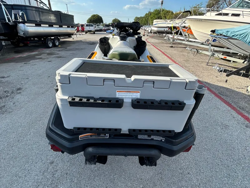 Slide: The Image of 2020 Sea-Doo FISH PRO 170 with storage box, parked among boats. - 29