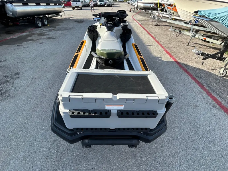 Slide: The Image of 2020 Sea-Doo FISH PRO 170 jet ski with fishing accessories, parked in a marina. - 31