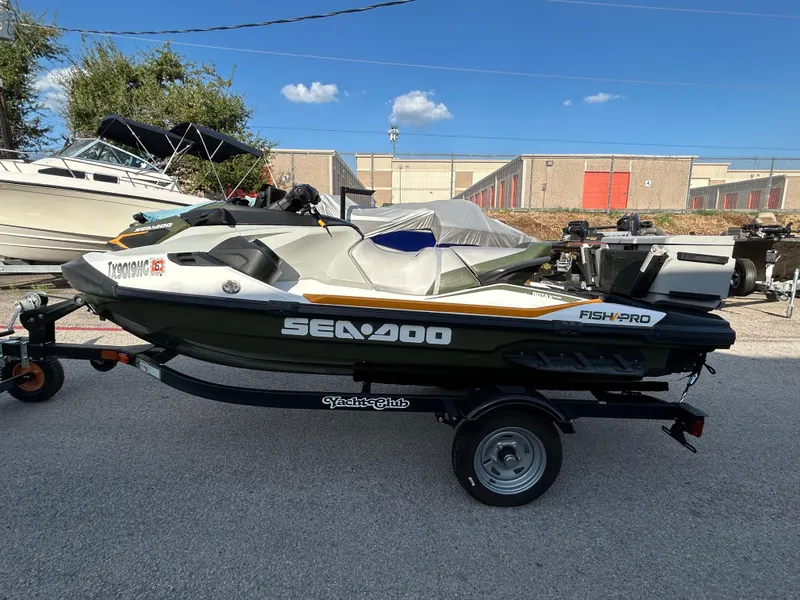 Slide: The Image of 2020 Sea-Doo FISH PRO 170 on trailer, parked outdoors under clear sky. - 4
