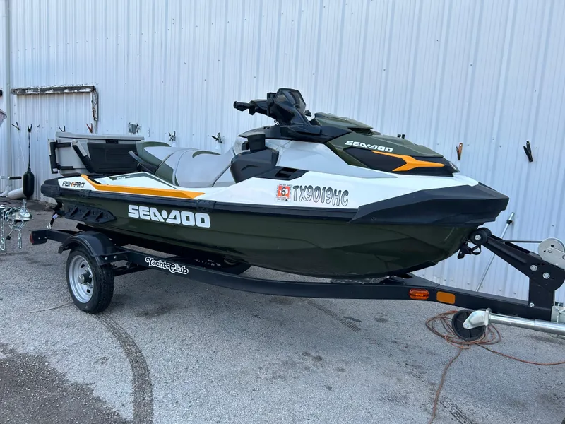 The Image of 2020 Sea-Doo FISH PRO 170 jet ski on trailer, parked outdoors. - 0