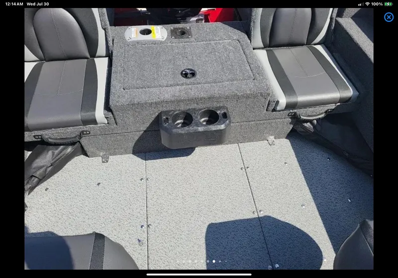 Slide: The Image of 2024 Lund 1675 Adventure Sport boat interior with gray seating and cup holders. - 19