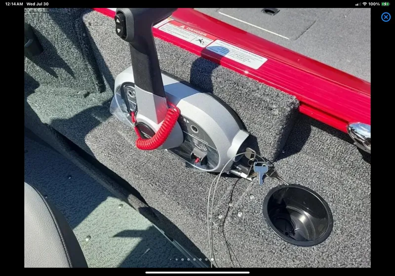 Slide: The Image of 2024 Lund 1675 Adventure Sport boat interior with control panel and cup holder. - 21