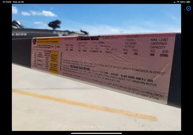 Slide: The Image of Sticker on a 2024 Lund 1675 Adventure Sport, displaying vehicle specifications and safety standards. - 24