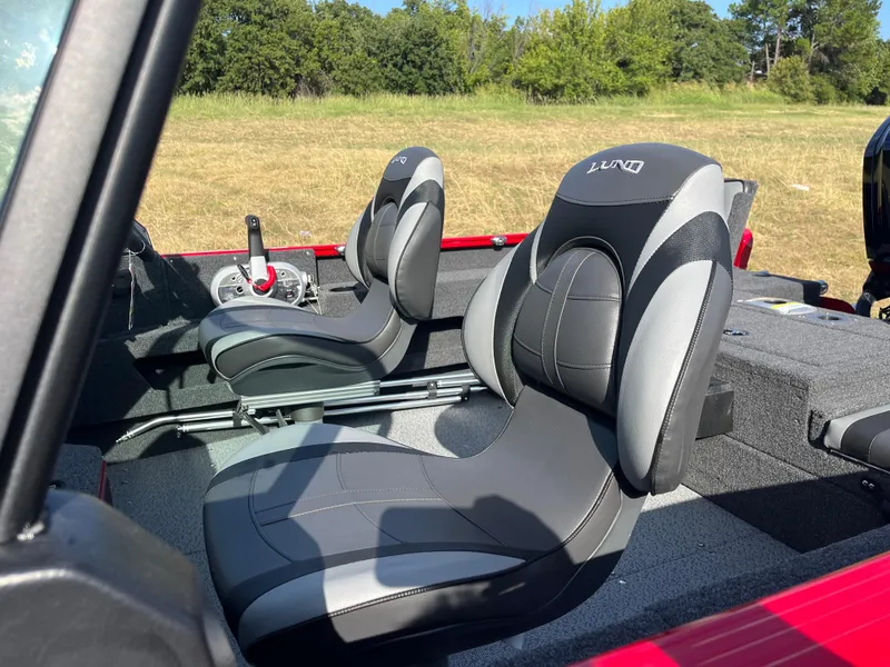 Slide: The Image of 2024 Lund 1675 Adventure Sport boat interior with two black and gray seats. - 28