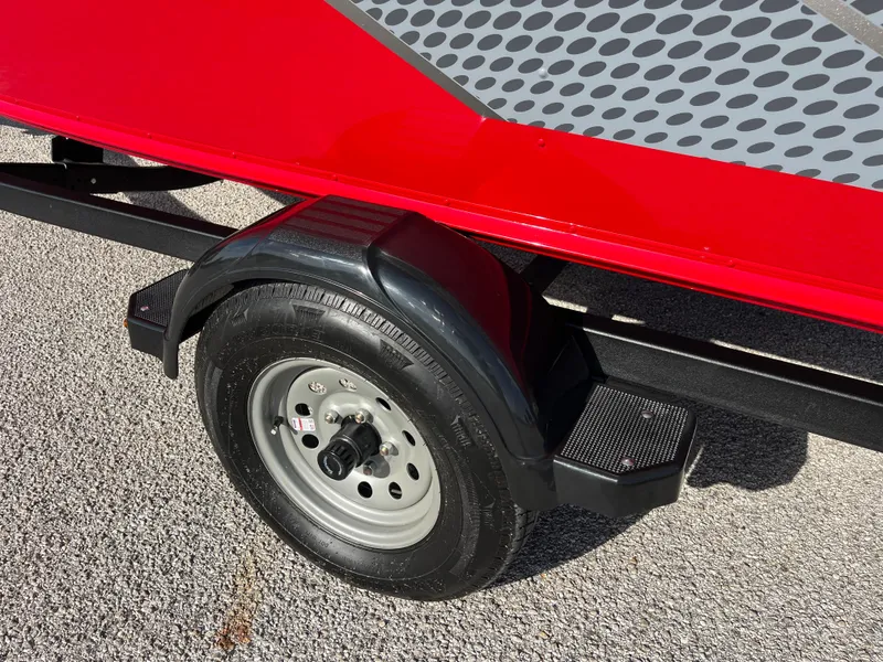 Slide: The Image of 2024 Lund 1675 Adventure Sport trailer wheel and fender, red and black design. - 32