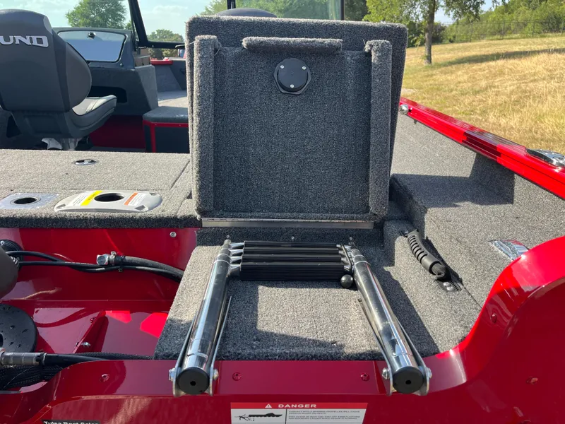 Slide: The Image of 2024 Lund 1675 Adventure Sport boat interior with foldable ladder and seating. - 37