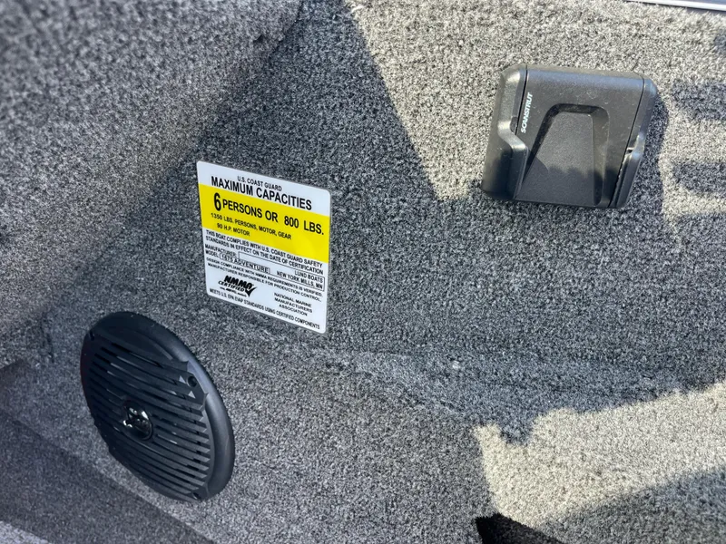 Slide: The Image of 2024 Lund 1675 Adventure Sport boat interior with capacity label and speaker. - 42