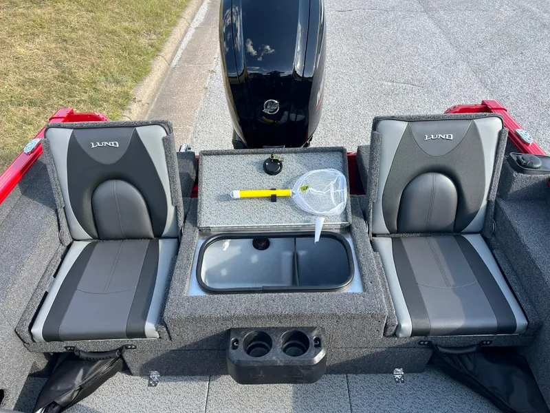 Slide: The Image of 2024 Lund 1675 Adventure Sport boat interior with seating and storage compartments. - 44