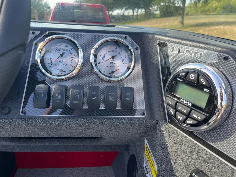 Slide: The Image of Dashboard of 2024 Lund 1675 Adventure Sport boat with gauges and controls. - 46