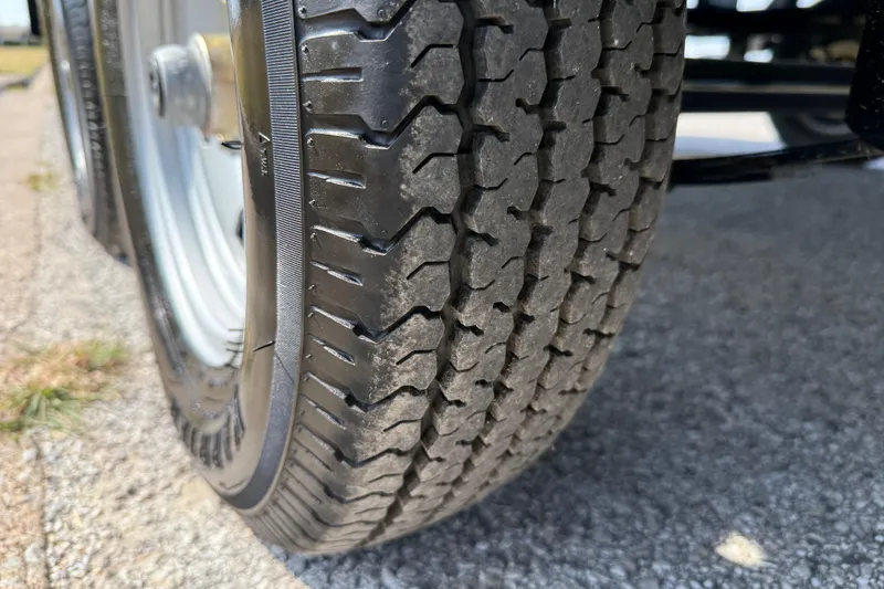 Slide: The Image of Close-up of a 2025 Flagship E22RF Sport Toon tire on asphalt. - 27