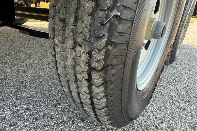 Slide: The Image of Close-up of a 2025 Flagship E22RF Sport Toon tire on gravel surface. - 32
