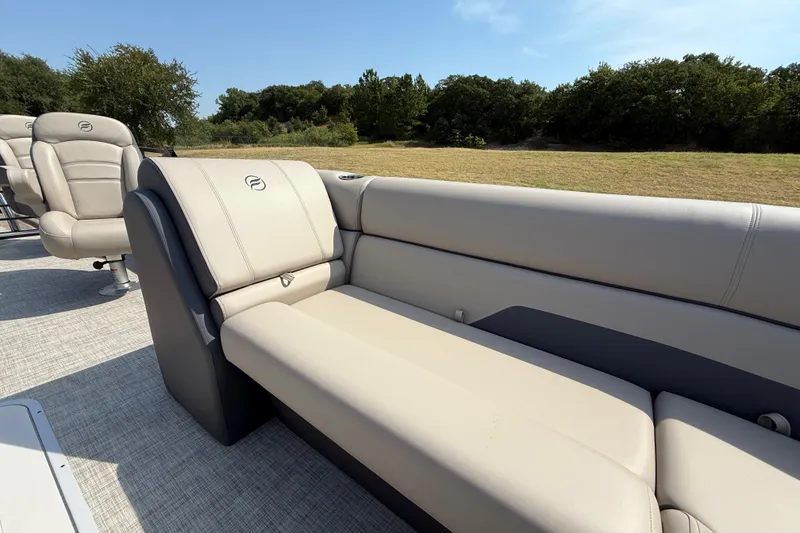 Slide: The Image of Luxurious seating on 2025 Flagship E22RF Sport Toon boat, surrounded by lush greenery. - 44