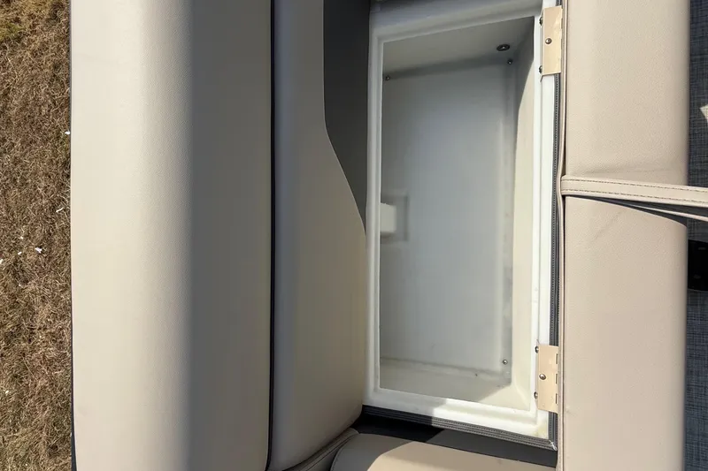 Slide: The Image of Open storage compartment in 2025 Flagship E22RF Sport Toon boat seat. - 46
