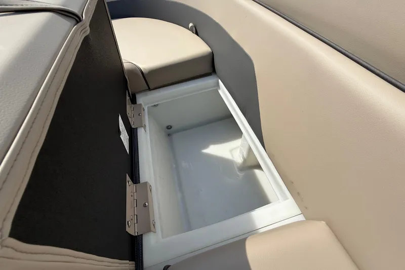 Slide: The Image of Open storage compartment in 2025 Flagship E22RF Sport Toon boat interior. - 51