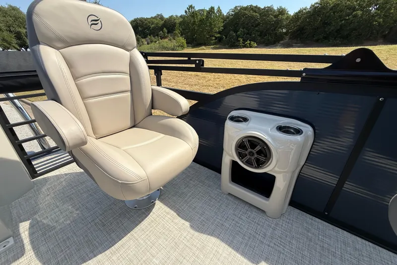 Slide: The Image of Luxurious seating on 2025 Flagship E22RF Sport Toon boat with integrated speaker system. - 59