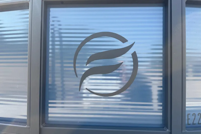 Slide: The Image of Flagship E22RF Sport Toon 2025 logo on frosted glass panel. - 6