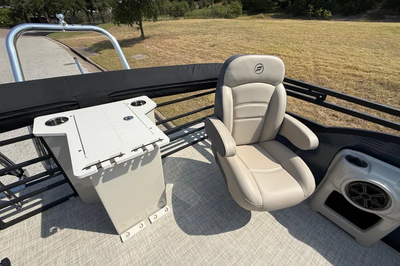 Slide: The Image of Captain's chair on 2025 Flagship E22RF Sport Toon boat, with console and speaker. - 62
