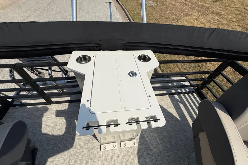 Slide: The Image of 2025 Flagship E22RF Sport Toon boat deck with seating and table setup. - 63