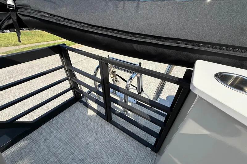 Slide: The Image of 2025 Flagship E22RF Sport Toon boat deck with railing and ladder. - 68