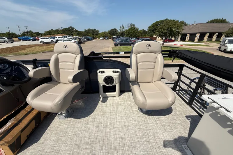 Slide: The Image of 2025 Flagship E22RF Sport Toon boat interior with two beige captain chairs. - 71
