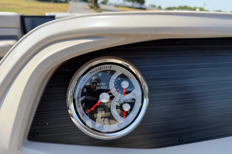 Slide: The Image of Dashboard of 2025 Flagship E22RF Sport Toon with RPM, volt, and fuel gauges. - 78