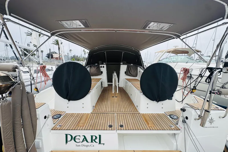 Slide: The Image of 2023 Jeanneau 380 sailboat with covered cockpit, docked in San Diego marina. - 17