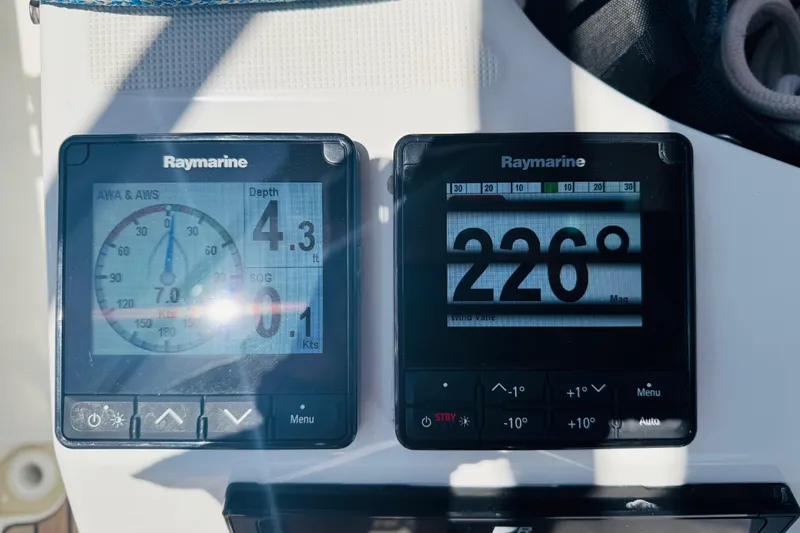 Slide: The Image of Raymarine navigation displays on 2023 Jeanneau 380 sailboat, showing depth and heading. - 24