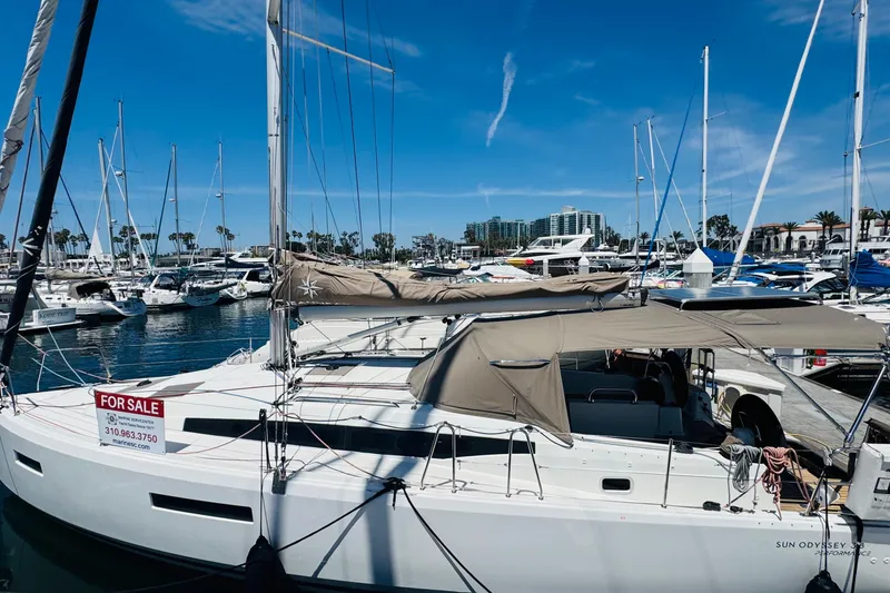Slide: The Image of 2023 Jeanneau 380 sailboat for sale docked at marina under clear blue sky. - 31