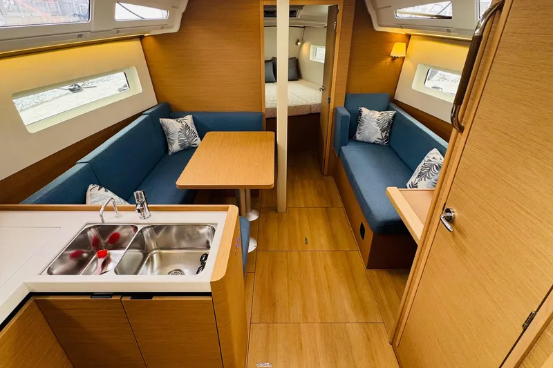 Slide: The Image of Interior of 2023 Jeanneau 380 yacht with modern kitchen and cozy seating area. - 41