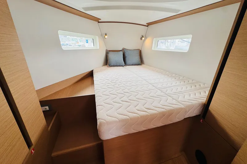 Slide: The Image of Luxurious cabin interior of 2023 Jeanneau 380 yacht with cozy bed and modern design. - 55