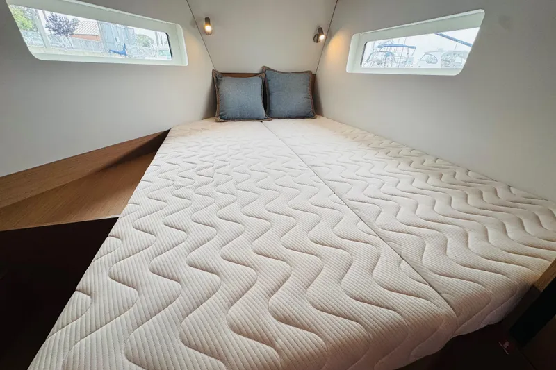 Slide: The Image of 2023 Jeanneau 380 yacht cabin with cozy bed and modern design. - 56