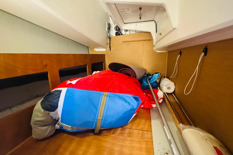 Slide: The Image of Interior storage space of 2023 Jeanneau 380 sailboat with colorful gear and equipment. - 66