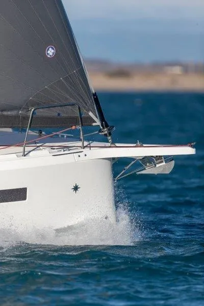 Slide: The Image of 2023 Jeanneau 380 sailboat cutting through blue ocean waters. - 76